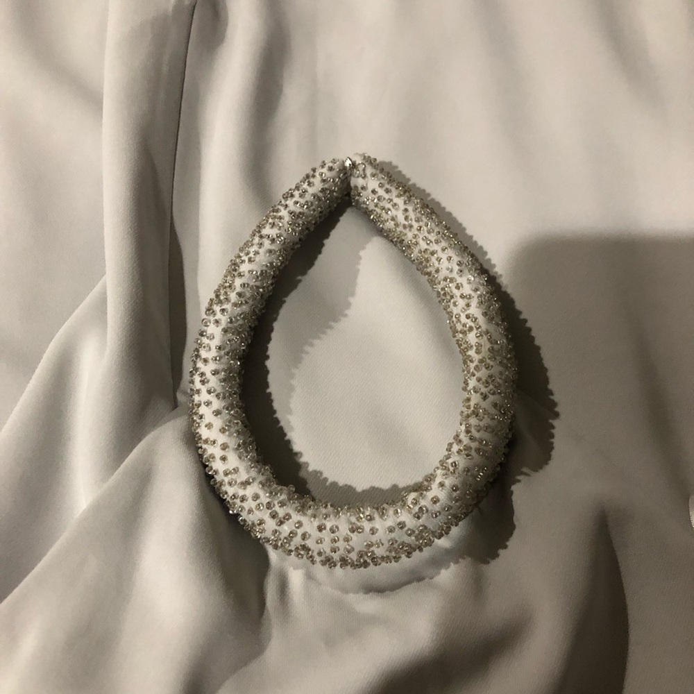Beautiful dress by Keepsake rolled beaded collar